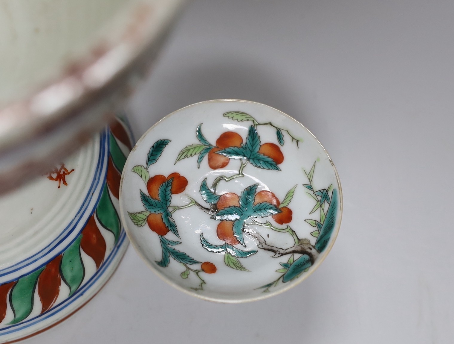 A small 19th Chinese stem dish decorated with peaches and a late 20th century large Wucai stem cup, 18.5cm